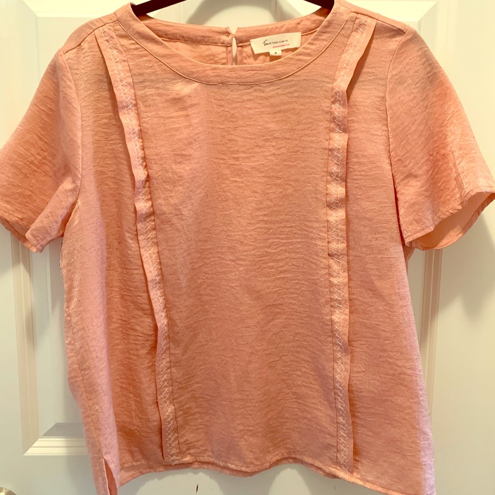Pink blouse with embroidered details